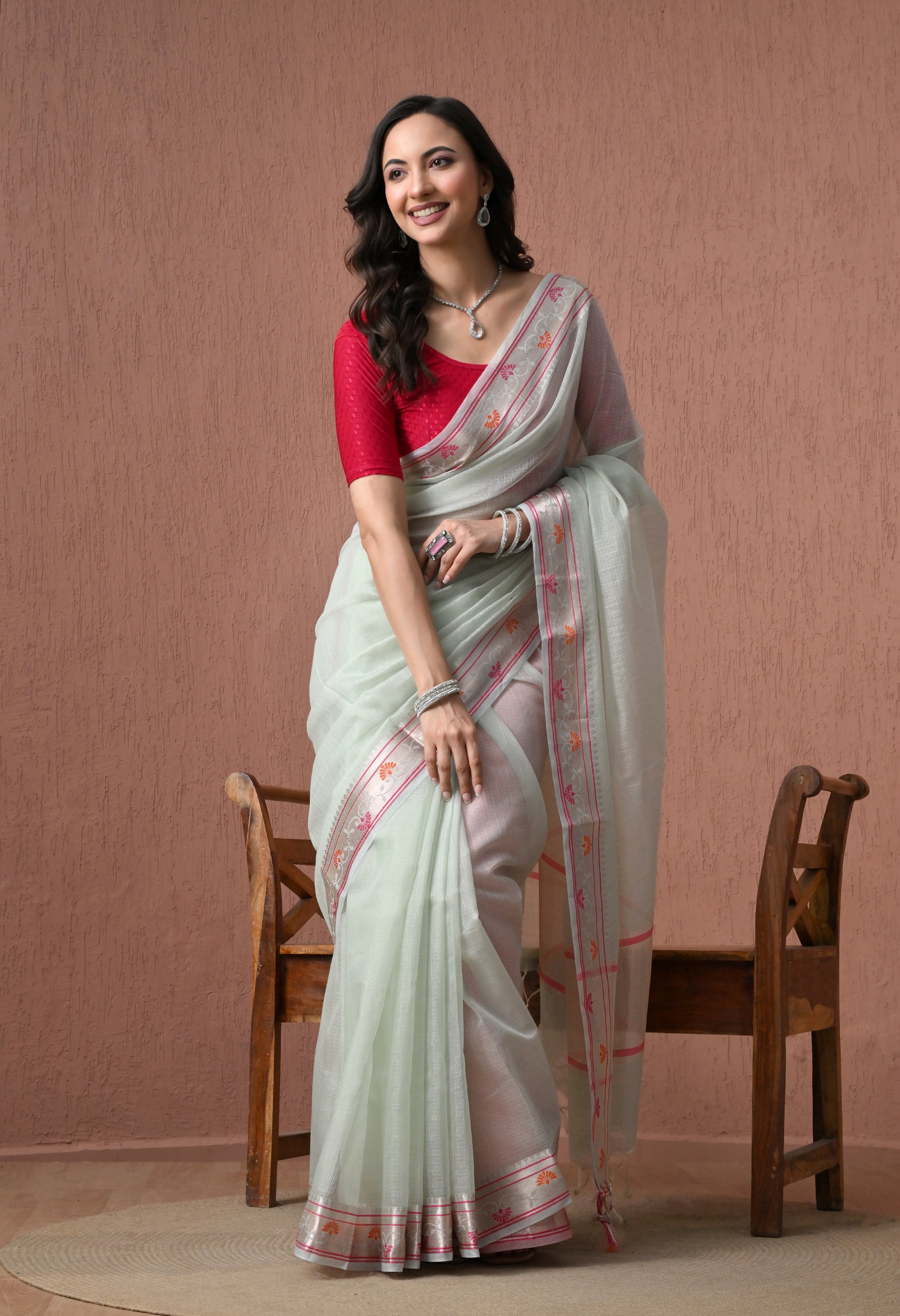 Pastel Mint Green Pure Cotton Saree with Festive Pink and Orange Border