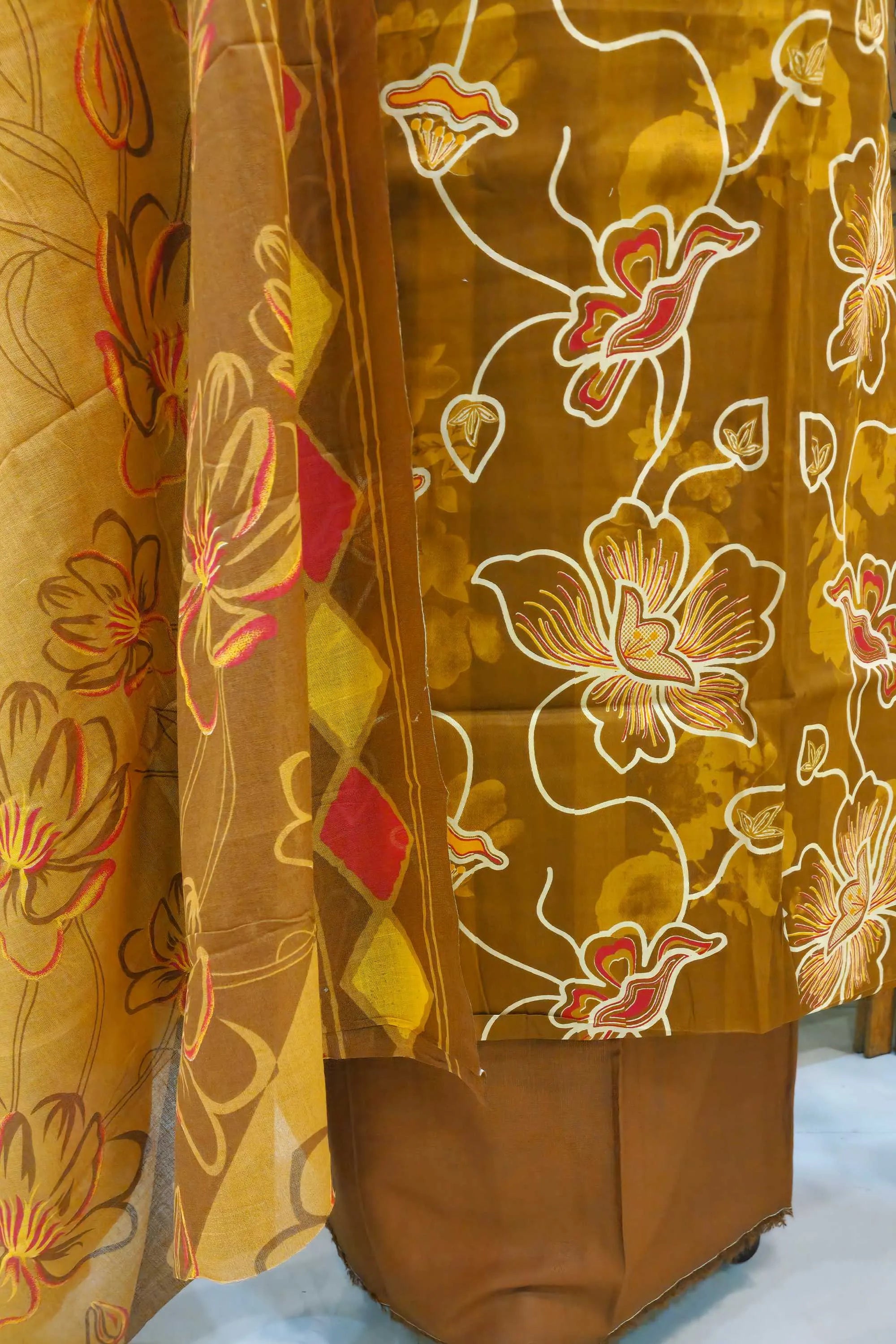 Women Brown & Mustard Floral Printed Unstitched Cotton Dress Material with Embellished Neckline