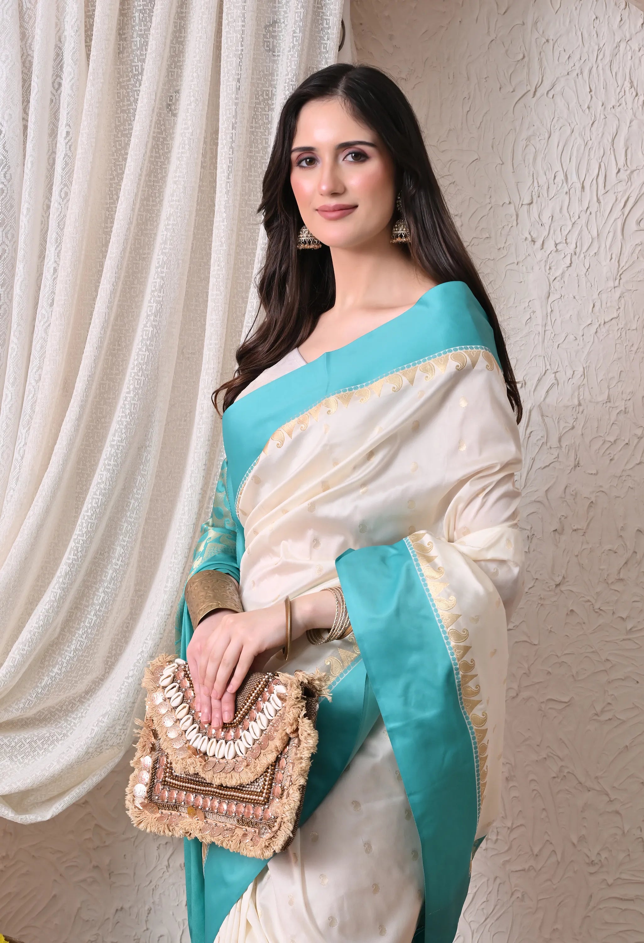 Enchanting Off-White and Turquoise Silk Blend Saree