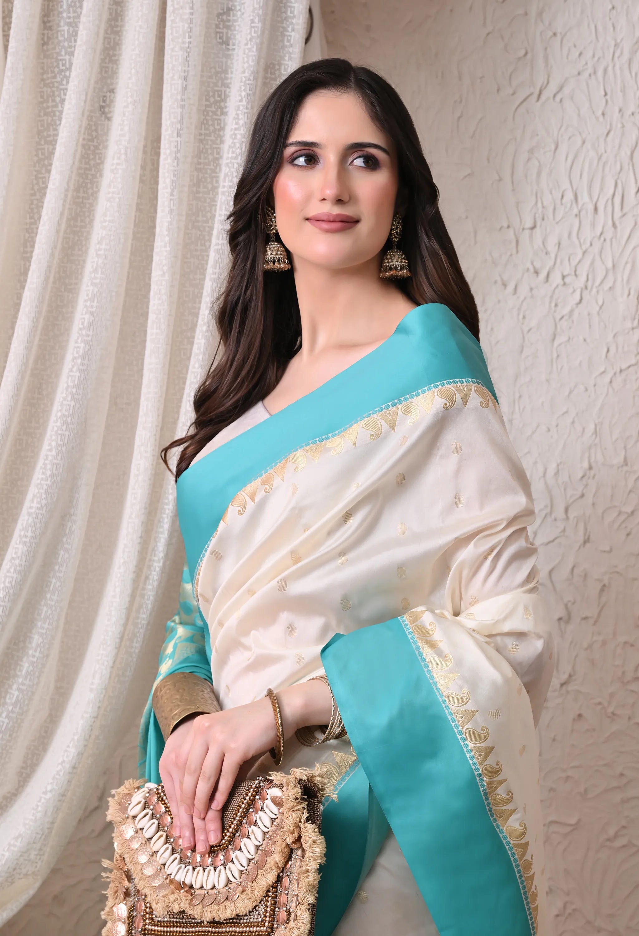 Enchanting Off-White and Turquoise Silk Blend Saree