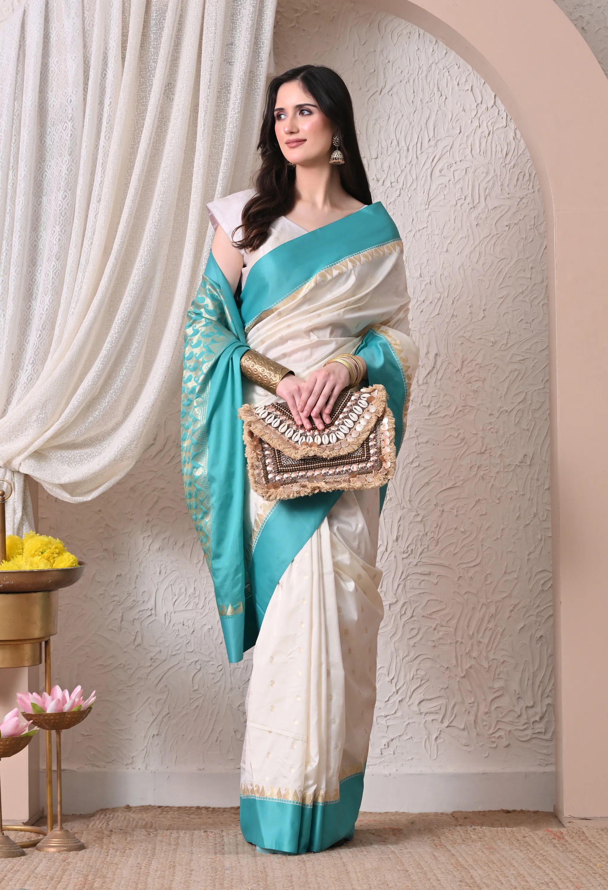 Enchanting Off-White and Turquoise Silk Blend Saree