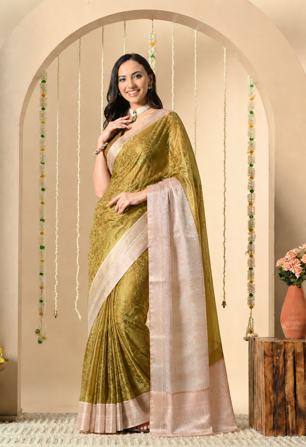 Mustard and blush pink silk blend saree with woven floral motifs and detailed border.
