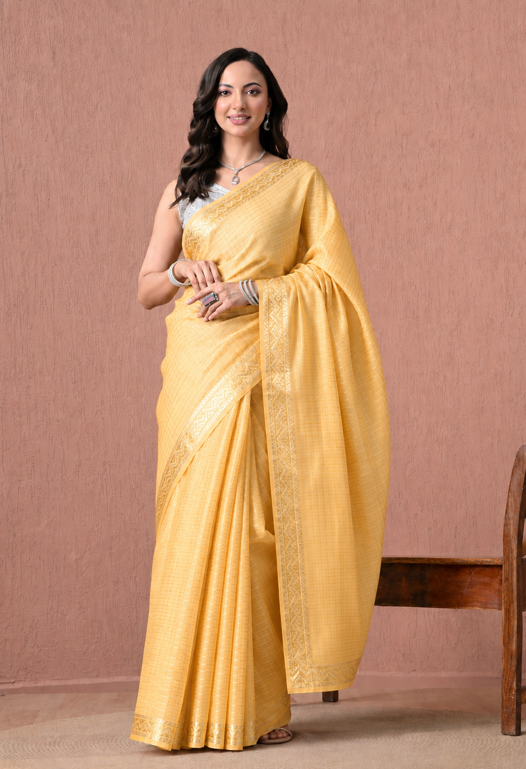 Mustard yellow cotton saree with checked body and traditional woven border