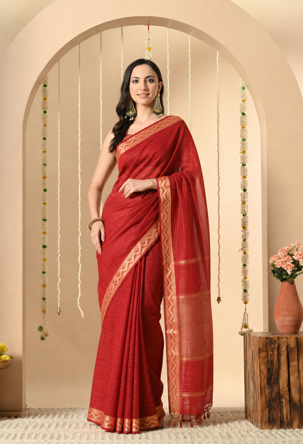 Red cotton saree with beige woven geometric border and tassel pallu