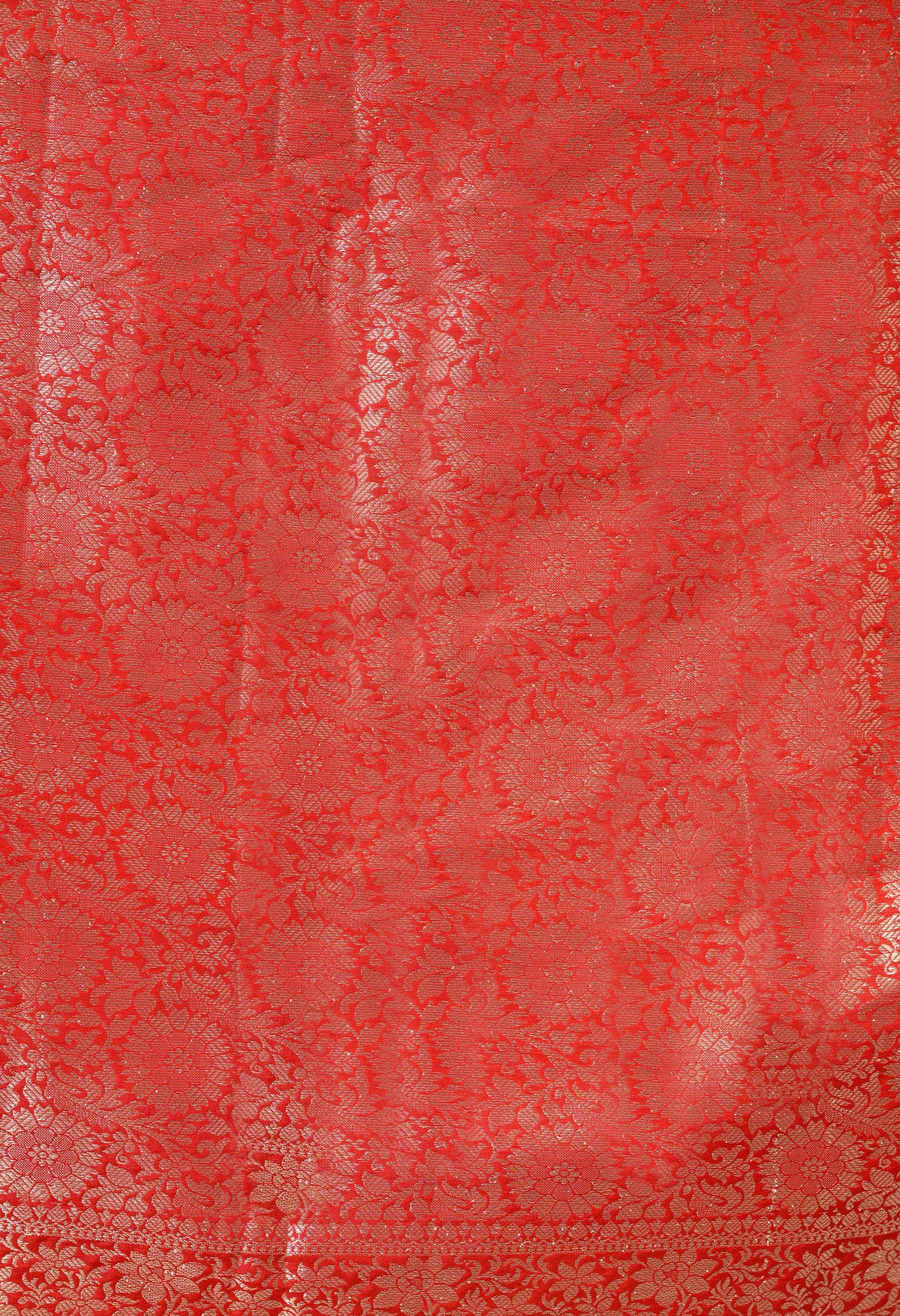 An 80 cm red banarasi saree blouse piece with zari detailing 