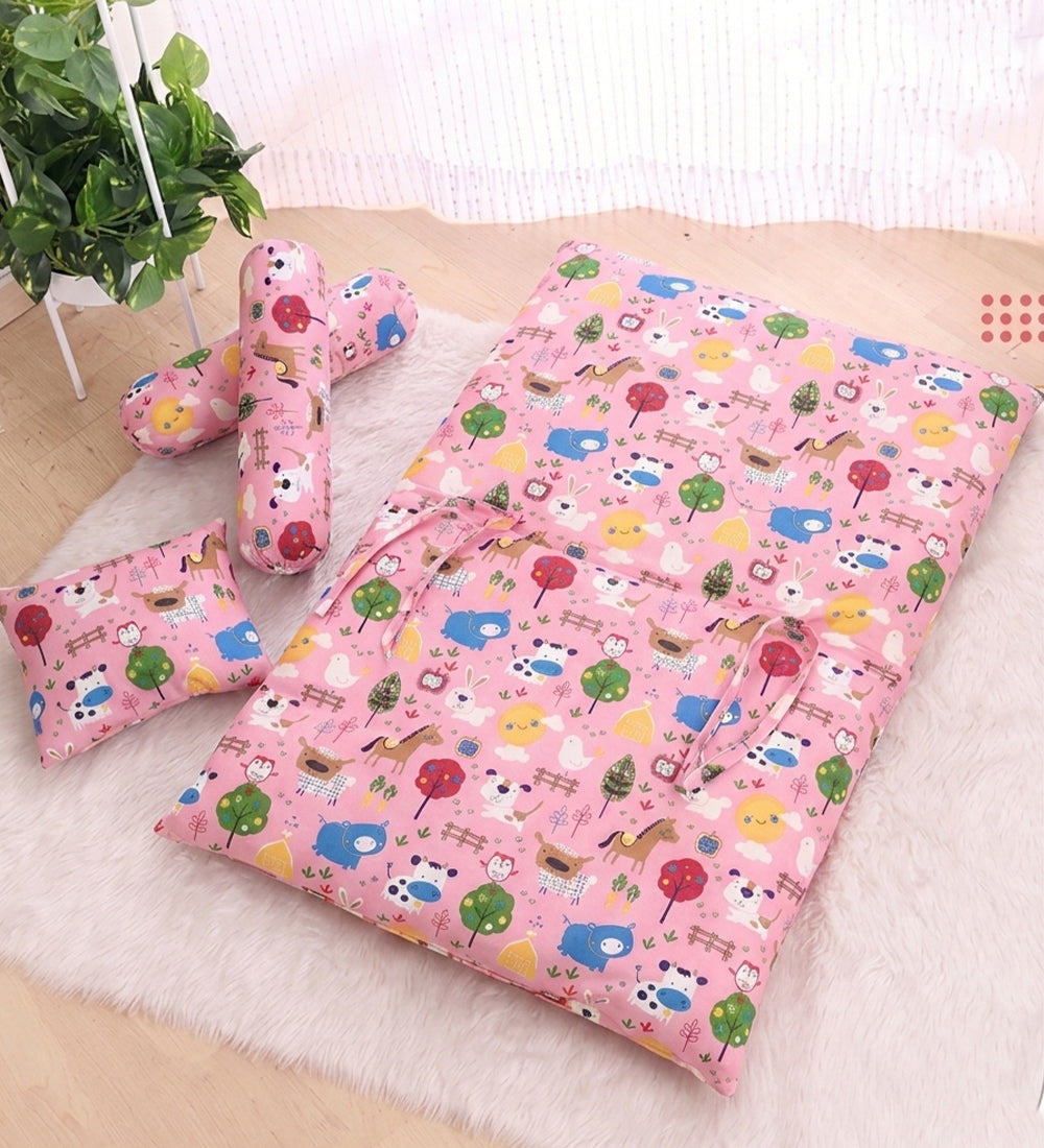 Premium pink 4-piece baby bedding set made of 100% breathable cotton, including a soft mattress, one cushioned neck support pillow, and two bolsters with a vibrant farm animal print.