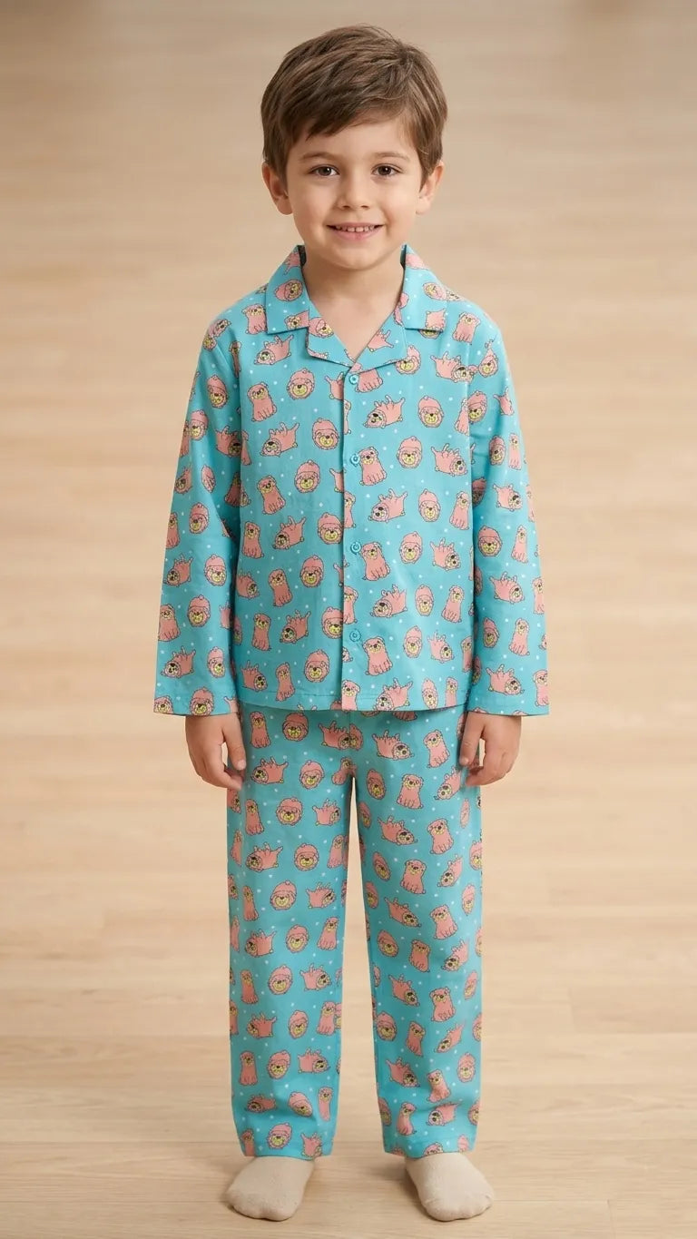 Young boy in a light blue and pink pug-printed full-sleeve cotton night suit with notched lapel collar and matching pyjamas
