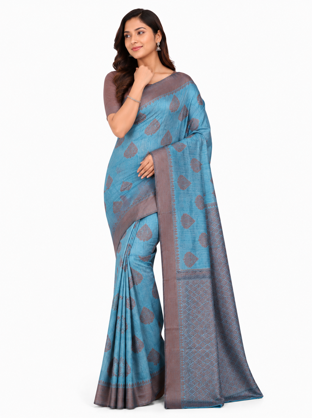 Woman in a blue Banarasi silk blend saree with grey leaf motifs and a dark grey Zari border, posing against a white background.