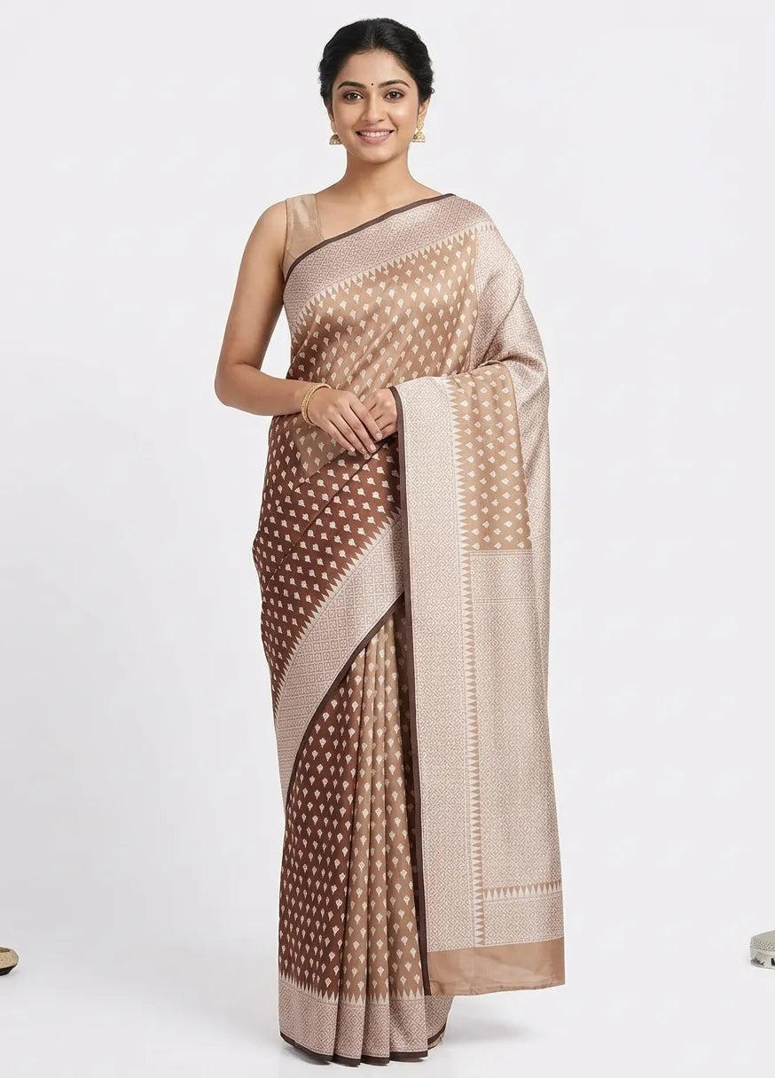 A woman posing in a Coffee Brown Banarasi saree featuring a gradient effect that transitions to soft beige, adorned with delicate woven "buti" motifs and a structured zari border.