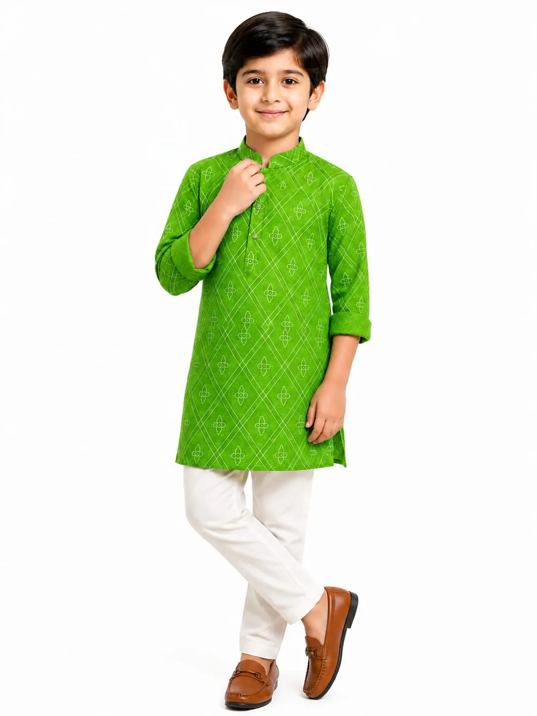 A young boy standing against a plain white background, wearing a bright green, long-sleeved cotton kurta with a white geometric diamond print, paired with solid white pyjama pants and brown loafers
