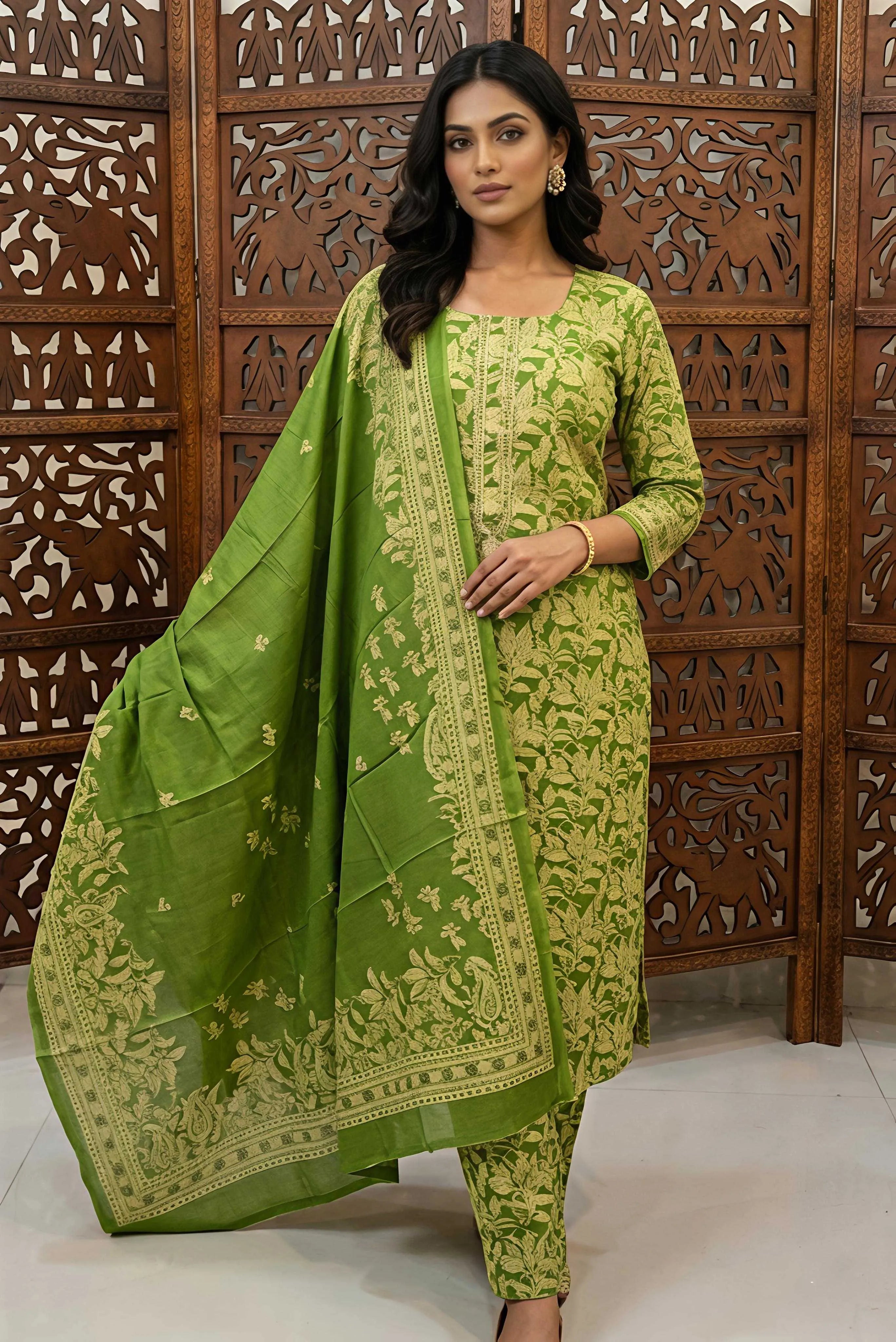 Mannequin showcasing a green and off-white floral printed cotton unstitched dress material with a matching printed dupatta and embroidered neckline.