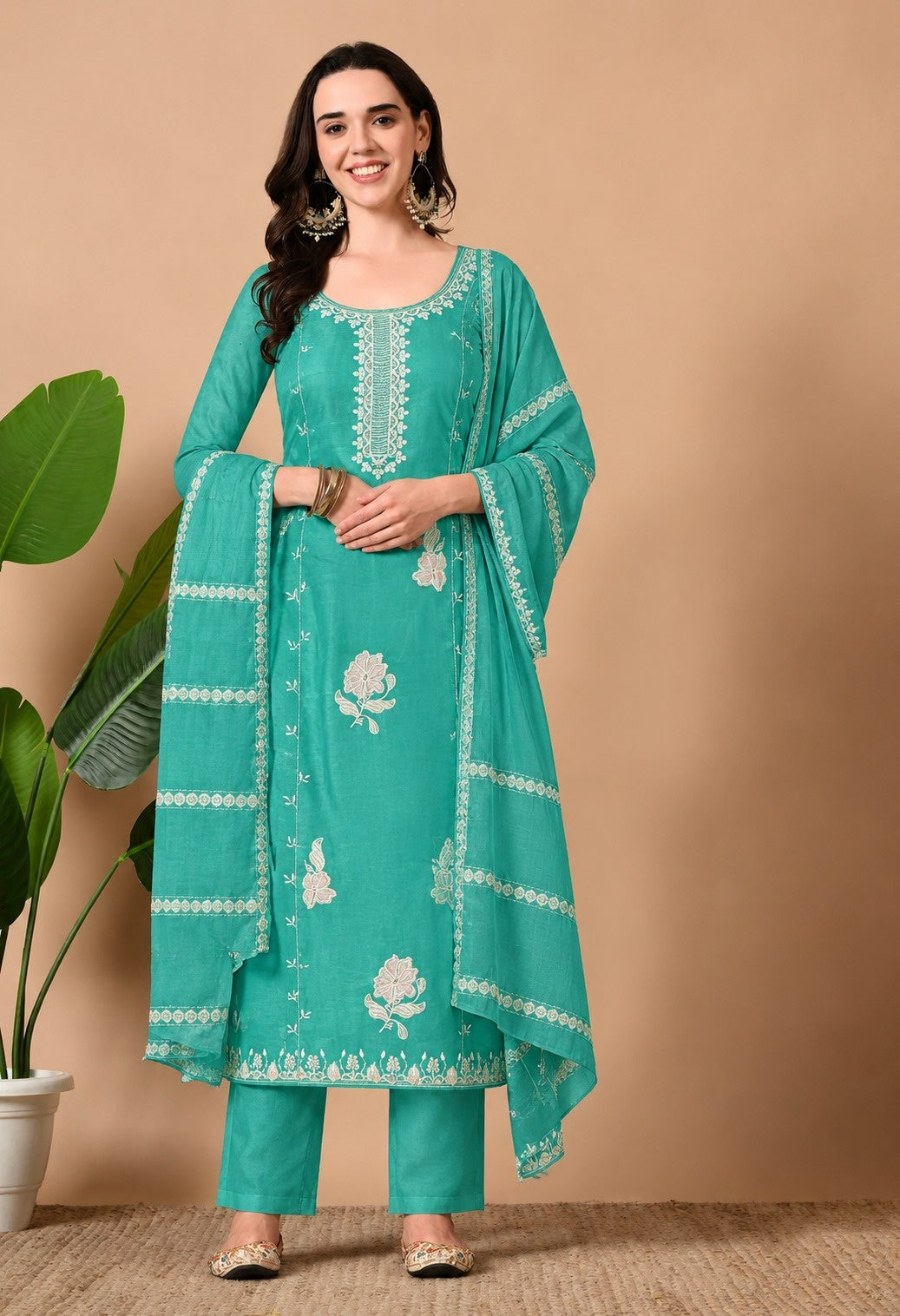 Teal green Chanderi silk embroidered kurta suit set with matching straight pants and an organza dupatta, featuring intricate white embroidery on the neckline, delicate floral motifs, and a decorative border on the dupatta.