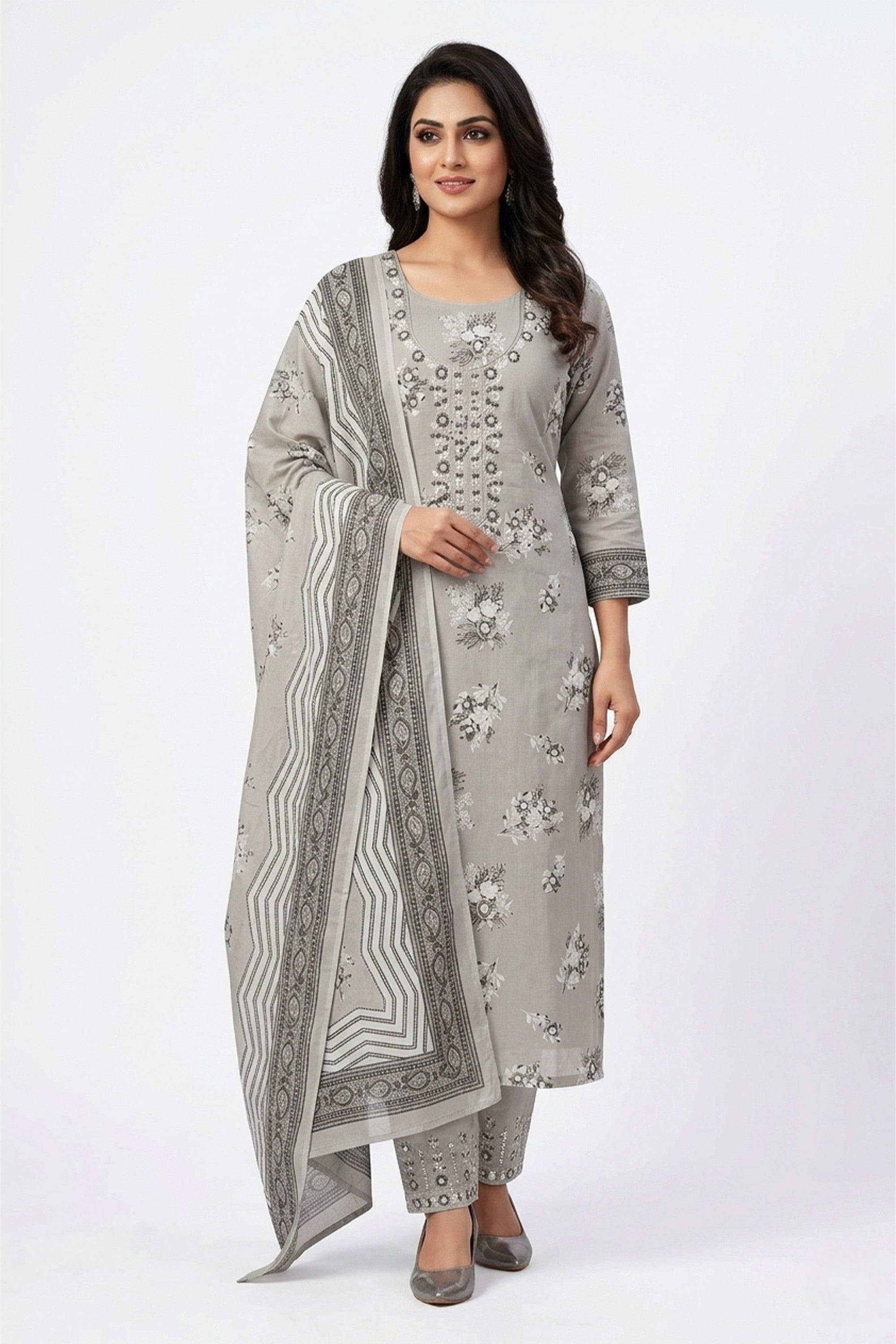 Metallic grey floral printed cotton unstitched suit on a mannequin with embroidered neck panel and patterned dupatta.
