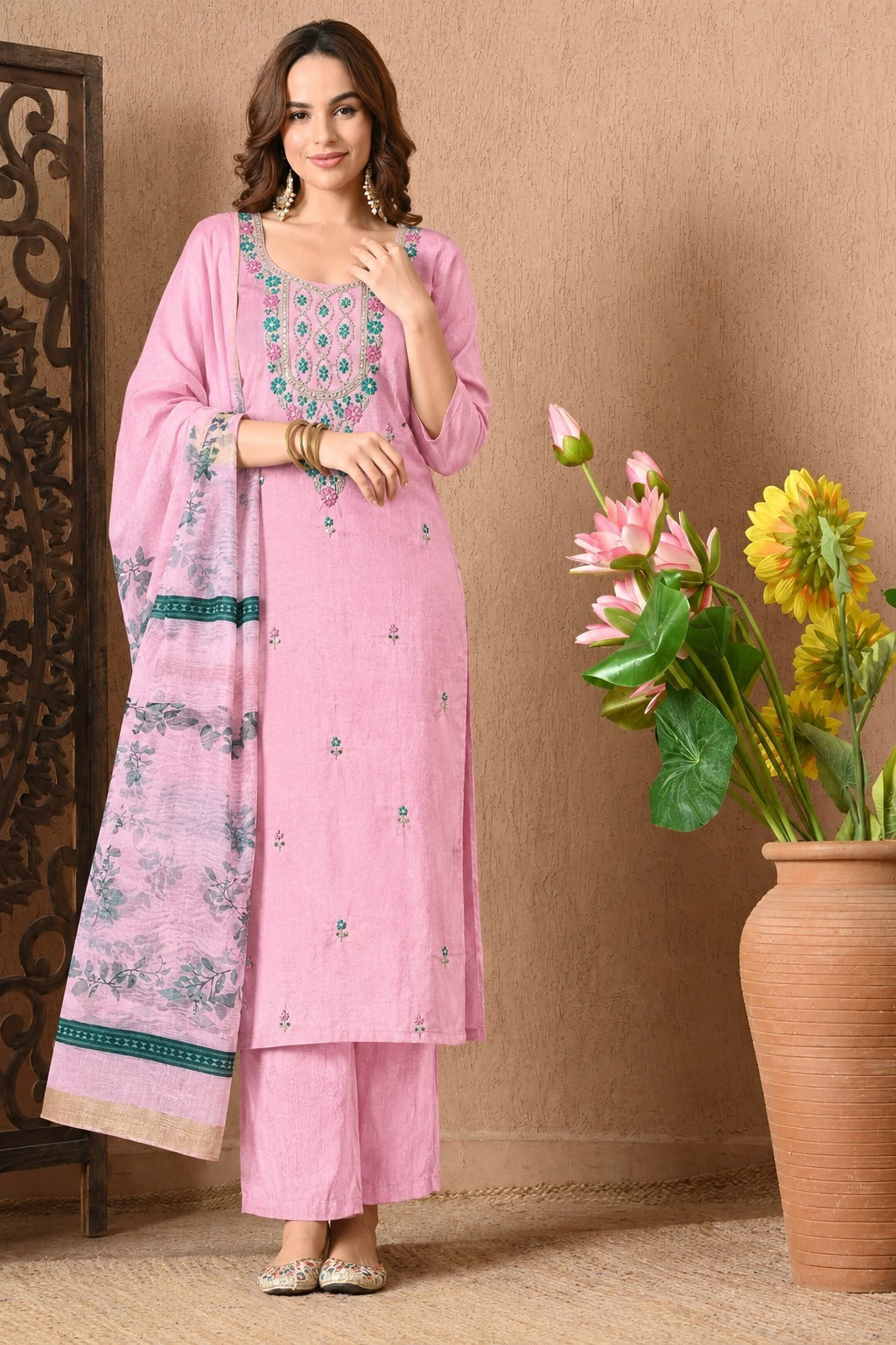 Pink Chanderi silk suit set with matching straight pants and a floral printed dupatta, featuring intricate turquoise embroidery on the front, delicate small motifs on the kurta, and a decorative teal border on the dupatta.
