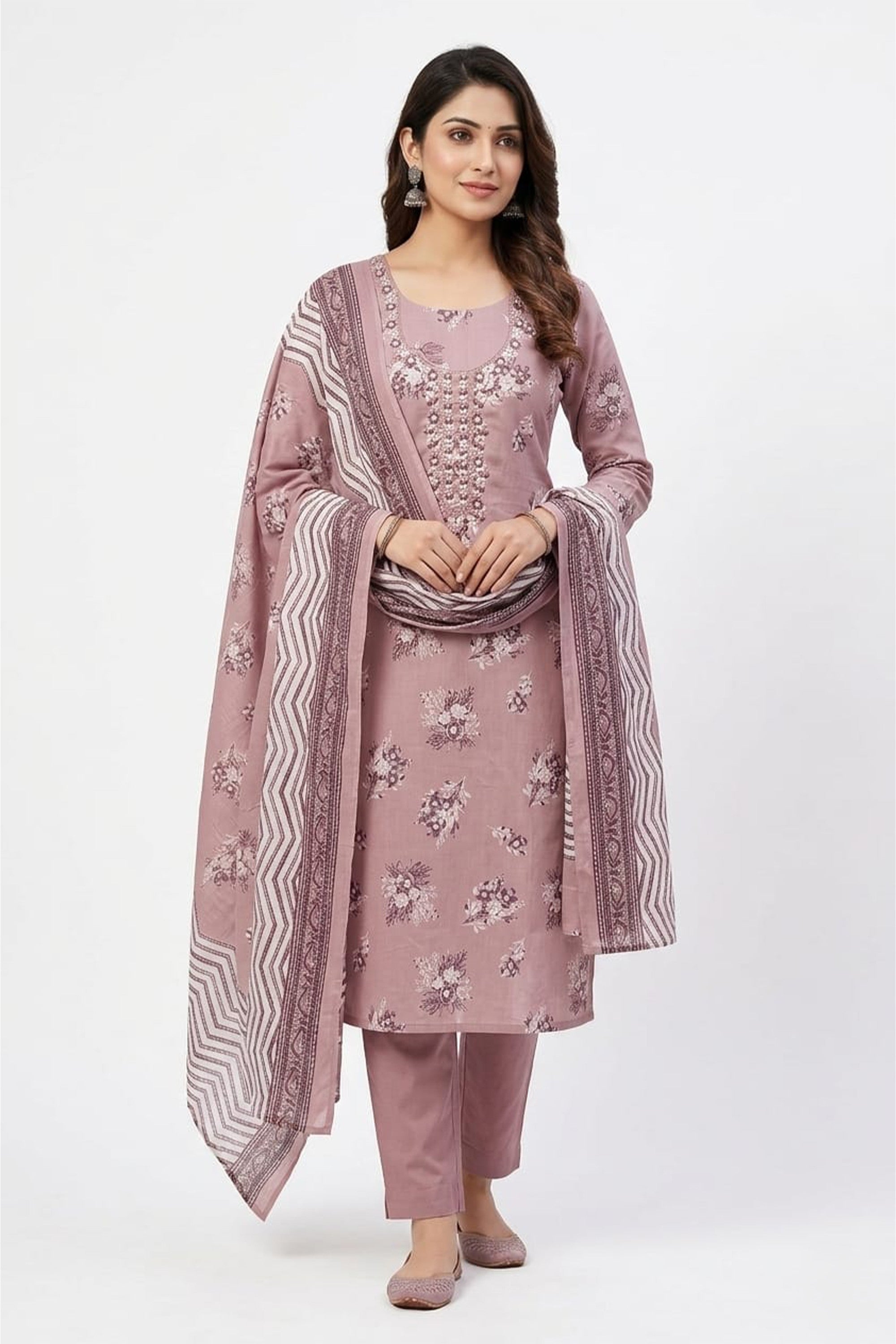 Dusty rose floral printed cotton unstitched suit on a mannequin with white thread-work embroidery and a patterned dupatta.
