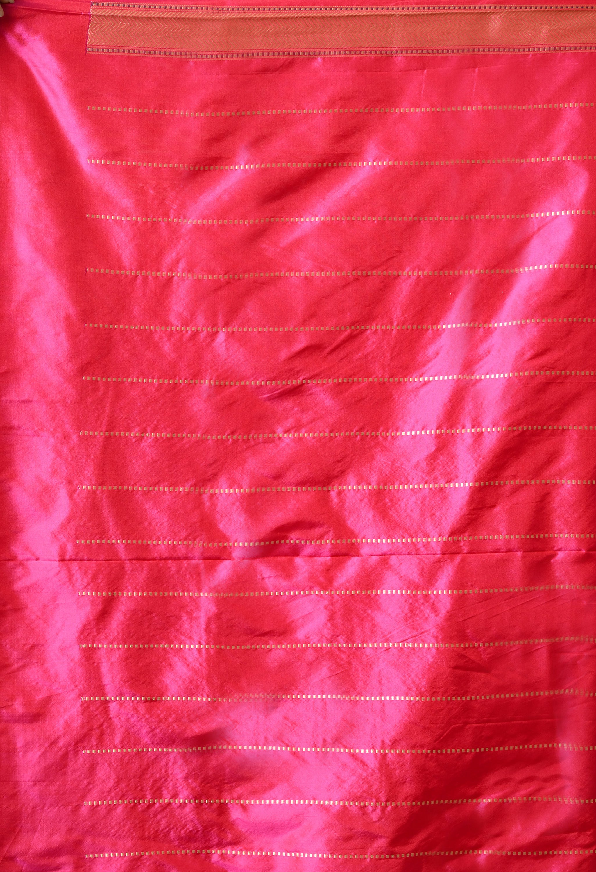 An eighty cm handwoven pure katan silk blouse piece with horizon lines of zari work