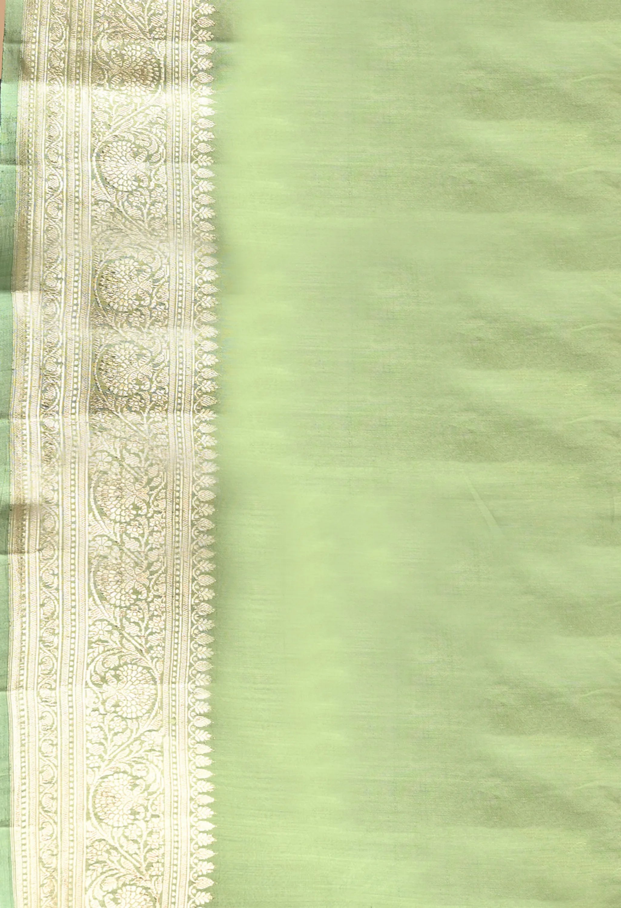 An 80 cm pure silk mint green  blouse piece with handwoven zari border 