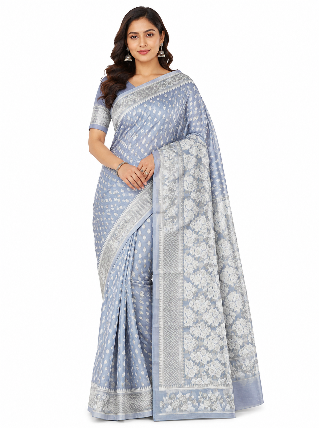 Model in a grey organza Banarasi saree featuring delicate off-white floral woven patterns, a sheer translucent texture, and a broad ornate border.