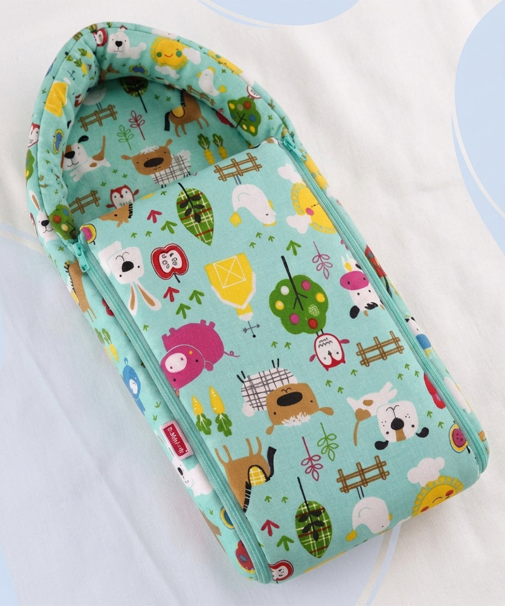 Colorful animal-printed baby sleeping bag and swaddle pod made of pure cotton, featuring a zip-up design and soft cushioned headrest for infants 0-6 months.