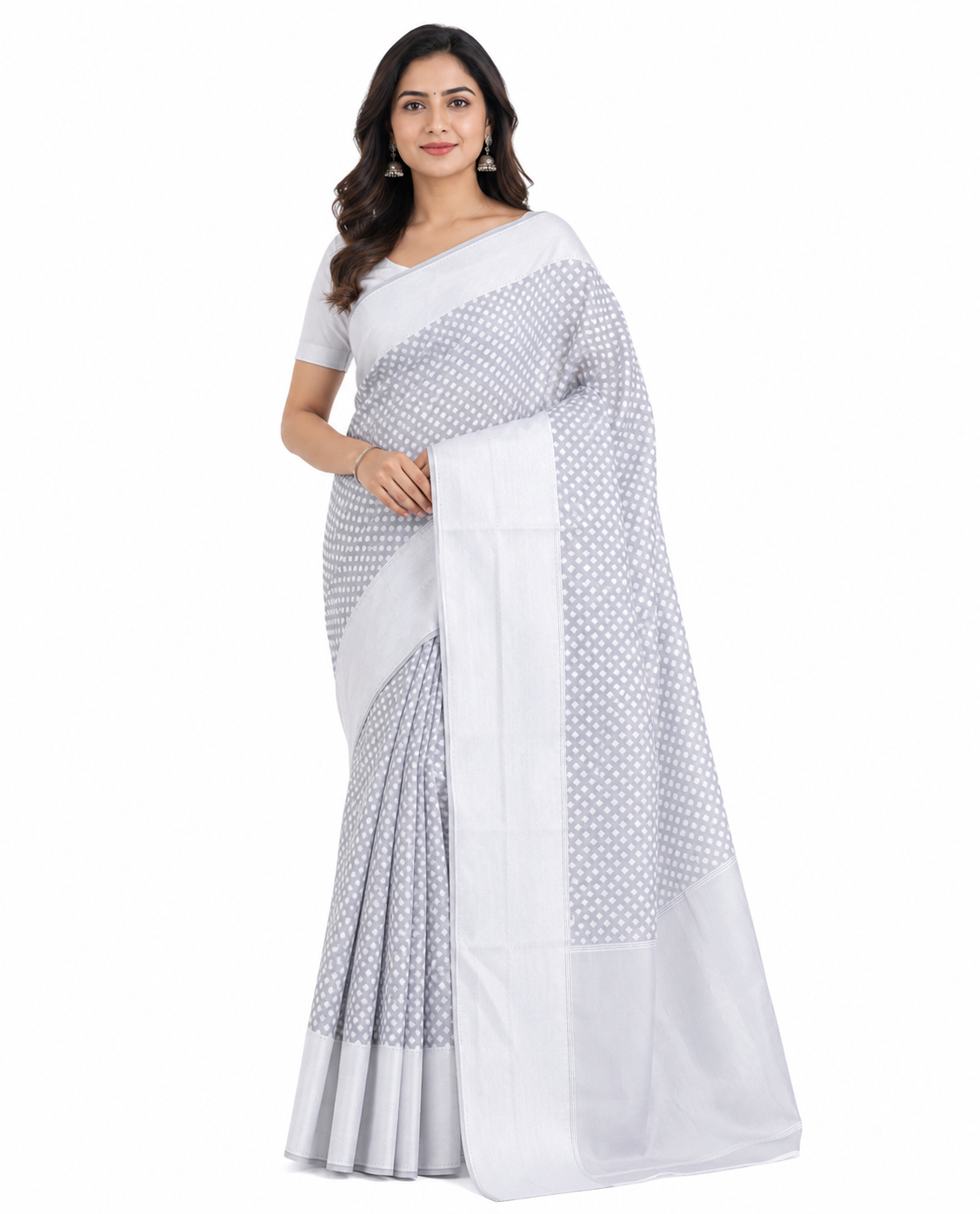Model wearing a steel grey silk blend Banarasi saree with silver-toned heart-shaped woven motifs, a shimmering pallu, and sleek metallic borders.